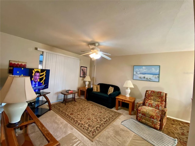 carpeted living room featuring ceiling fan