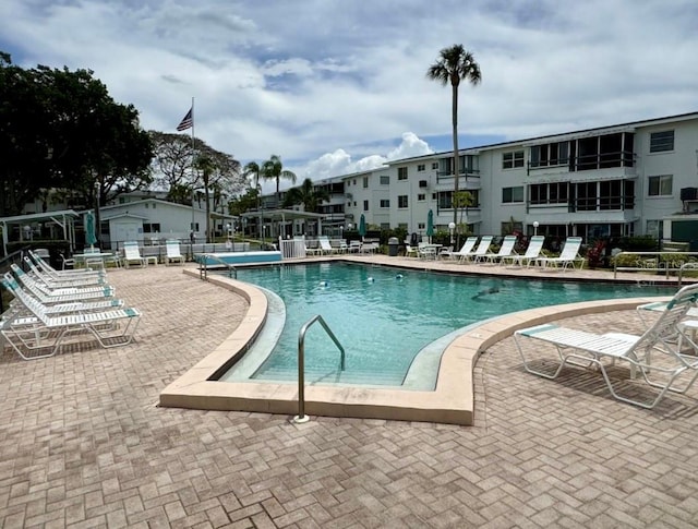 view of swimming pool featuring a patio