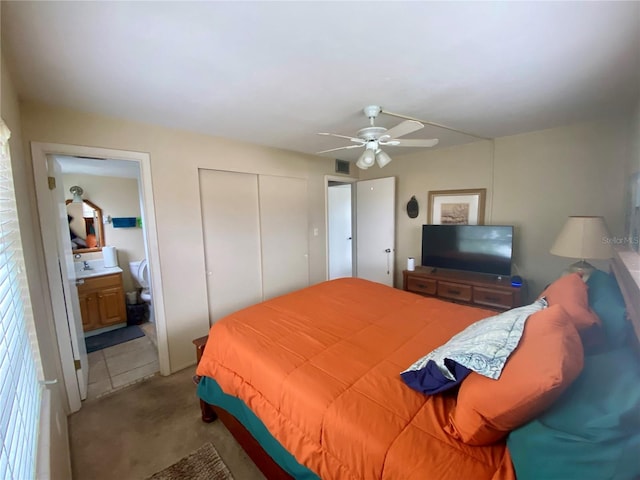 bedroom featuring ensuite bathroom and ceiling fan