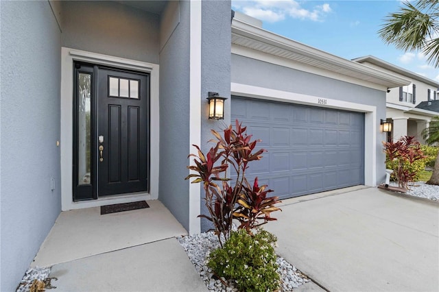 doorway to property featuring a garage