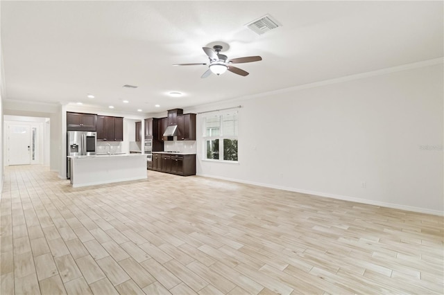 unfurnished living room featuring ceiling fan, crown molding, and light hardwood / wood-style flooring