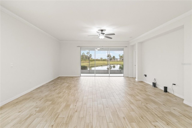 empty room featuring ceiling fan, ornamental molding, light hardwood / wood-style flooring, and a water view