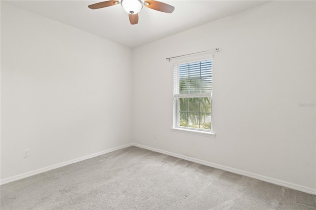 empty room featuring ceiling fan and carpet floors