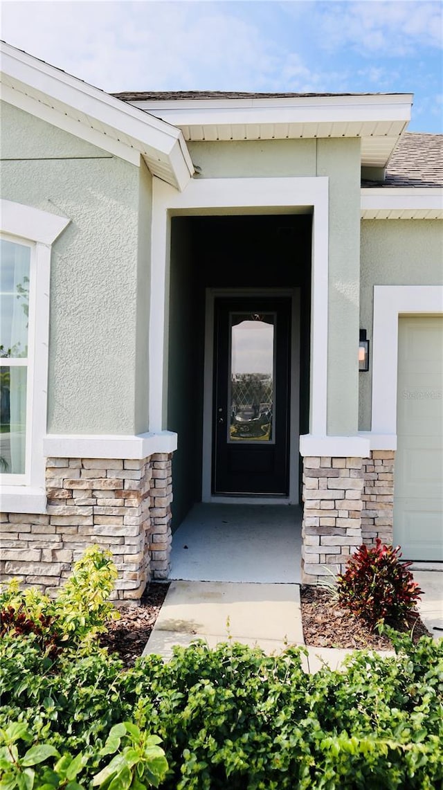 entrance to property featuring a garage