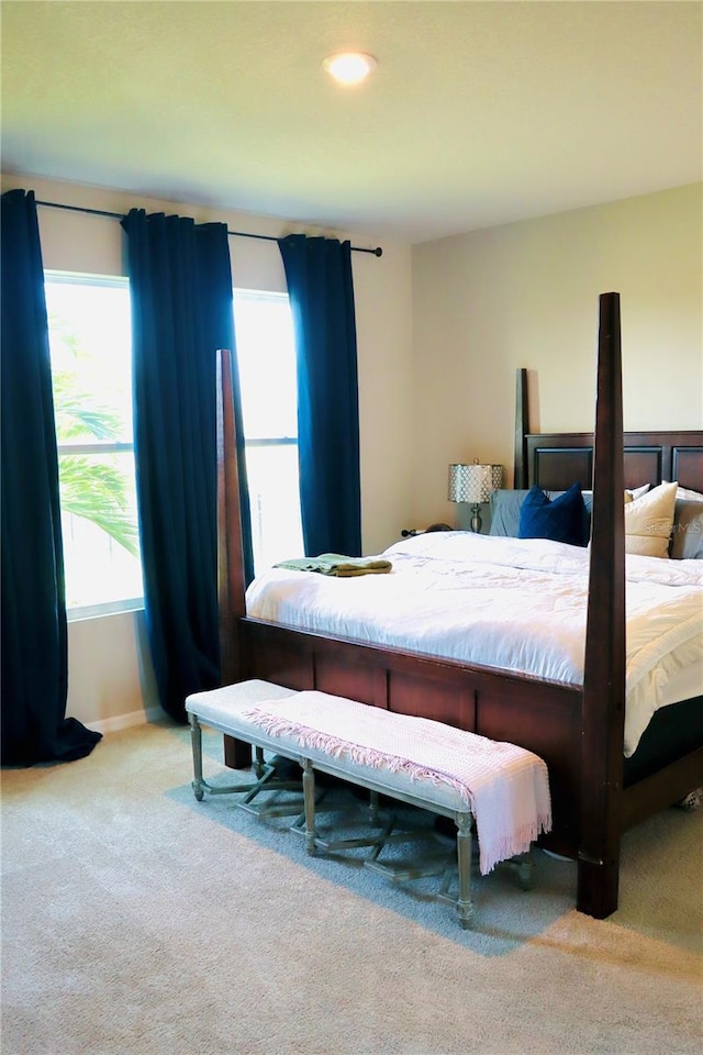 bedroom featuring light colored carpet