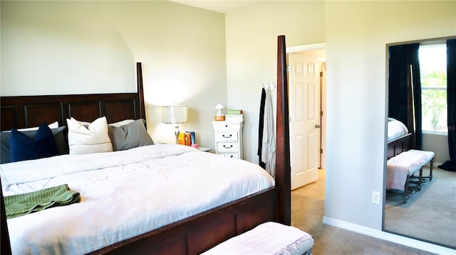 bedroom with light colored carpet