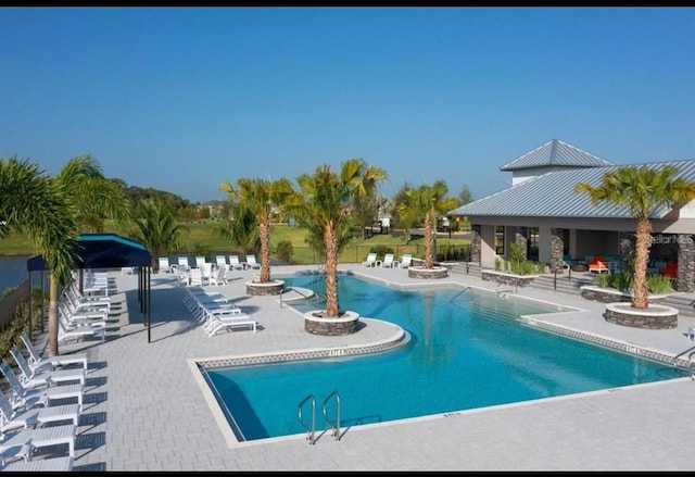 view of swimming pool with a gazebo and a patio