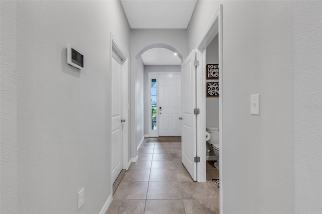 hallway with light tile patterned floors