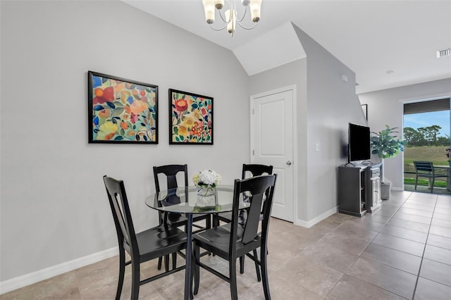 dining area featuring vaulted ceiling, an inviting chandelier, and light tile patterned flooring