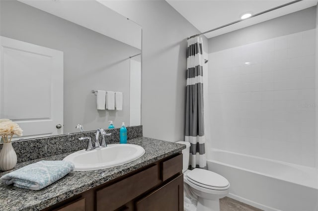 full bathroom featuring toilet, vanity, and shower / bath combination with curtain