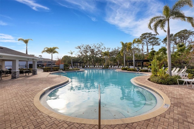 view of swimming pool with a patio