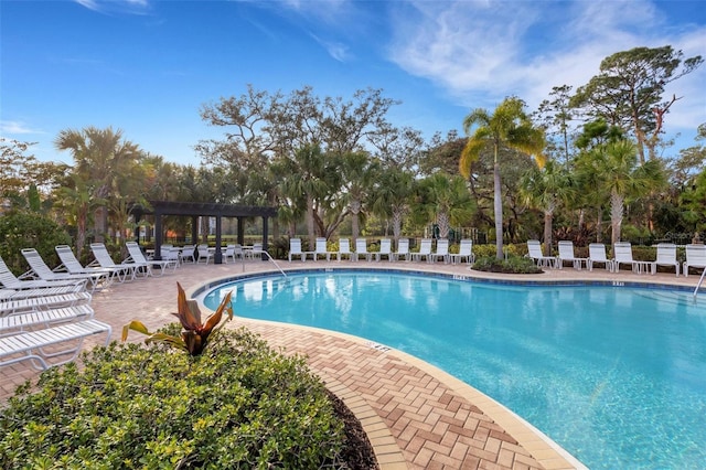 view of pool featuring a pergola and a patio area