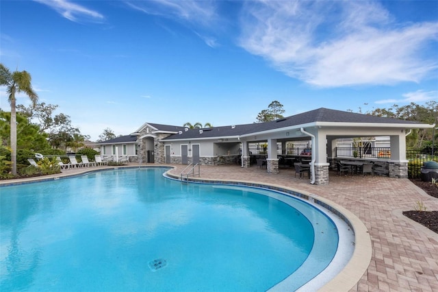 view of swimming pool featuring a patio