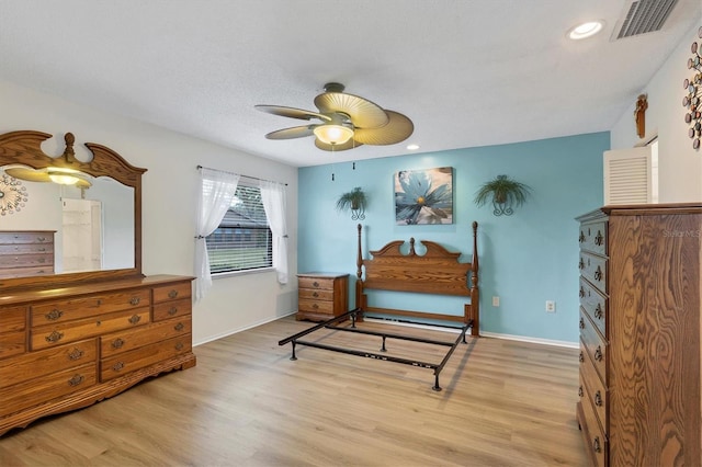 bedroom featuring ceiling fan and light hardwood / wood-style floors