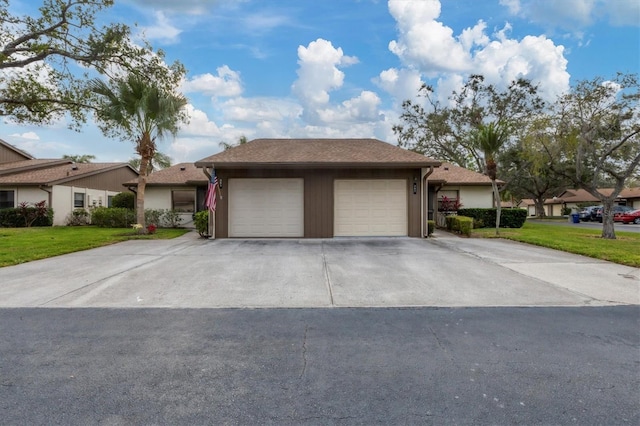 view of front facade with a front yard and a garage