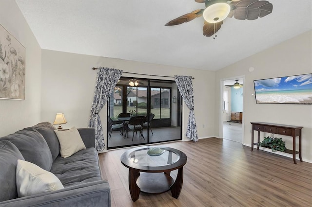 living room with lofted ceiling and wood-type flooring