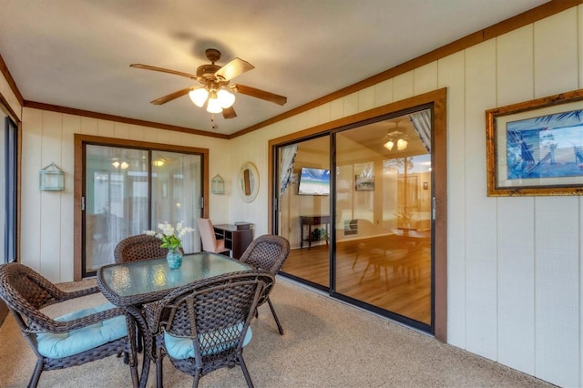 sunroom / solarium with ceiling fan