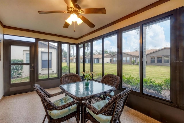 sunroom with ceiling fan