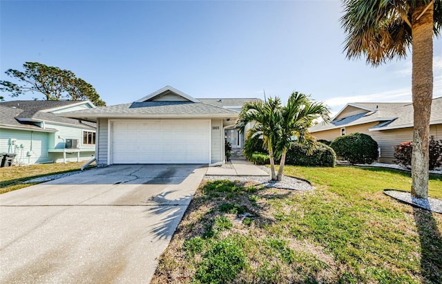 single story home featuring a garage and a front yard