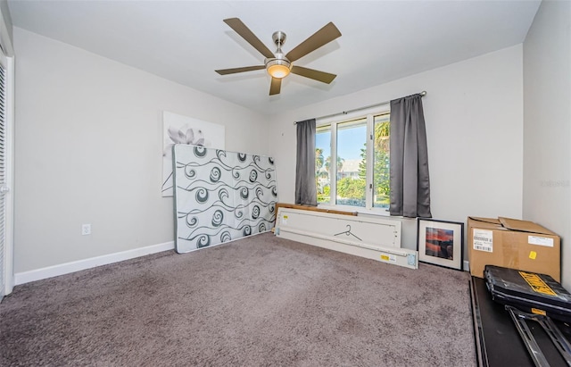 interior space featuring carpet and ceiling fan