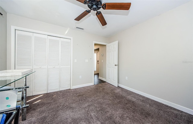 interior space with ceiling fan, a closet, and carpet