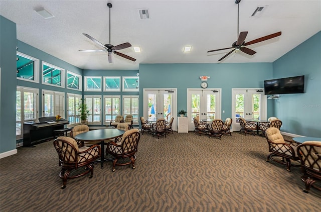 interior space featuring french doors, a wealth of natural light, and ceiling fan