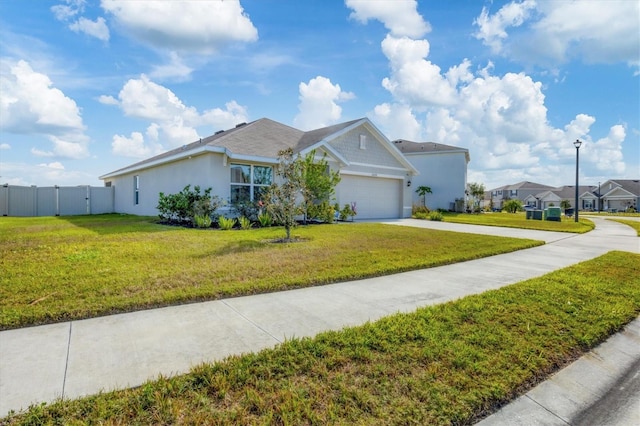 single story home with a front lawn and a garage