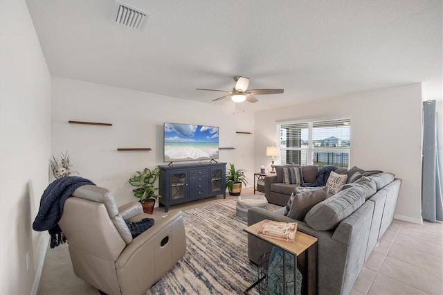 tiled living room featuring ceiling fan