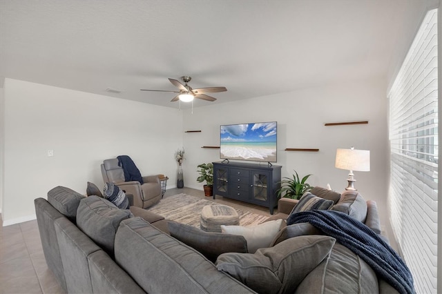 tiled living room with ceiling fan