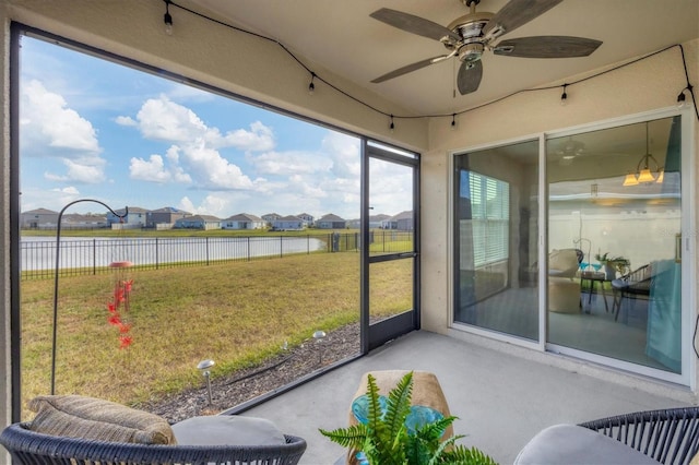 sunroom / solarium with ceiling fan