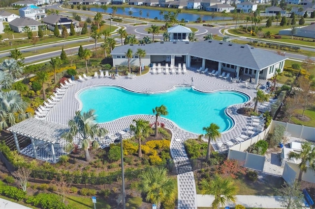 view of pool featuring a patio and a water view