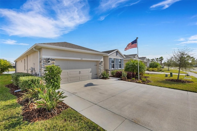 single story home with a front yard and a garage