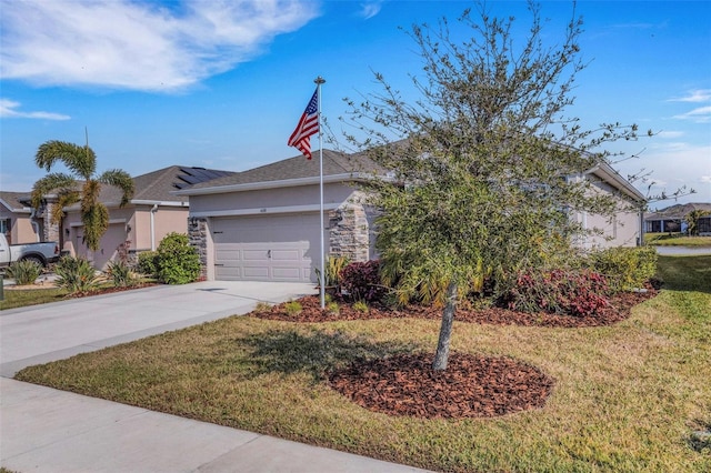 view of front of property with a front yard and a garage