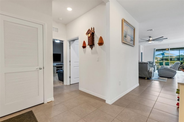 hallway with light tile patterned floors