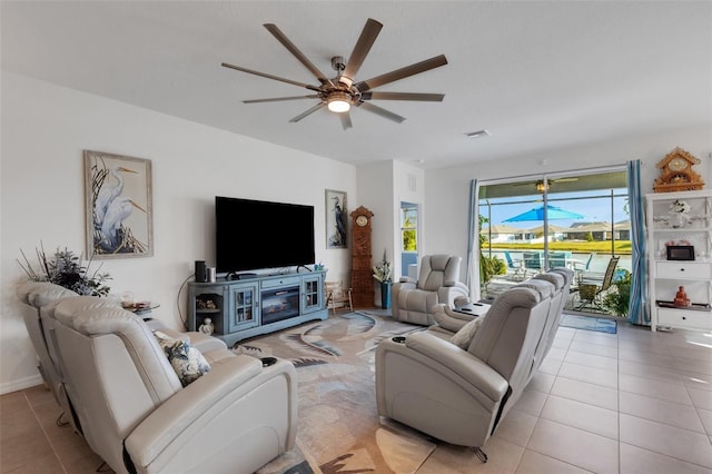 tiled living room featuring ceiling fan