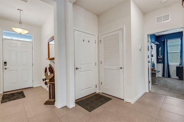 entrance foyer with light tile patterned floors