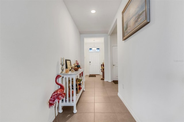 hallway featuring light tile patterned flooring