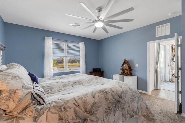 bedroom featuring light carpet and ceiling fan