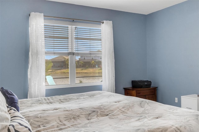 bedroom with multiple windows