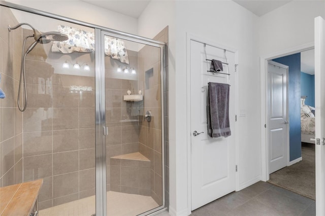 bathroom featuring tile patterned flooring and walk in shower