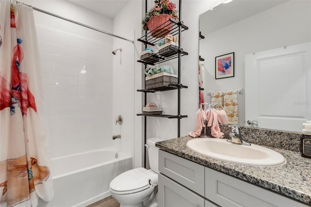 full bathroom with shower / bath combination with curtain, vanity, and toilet