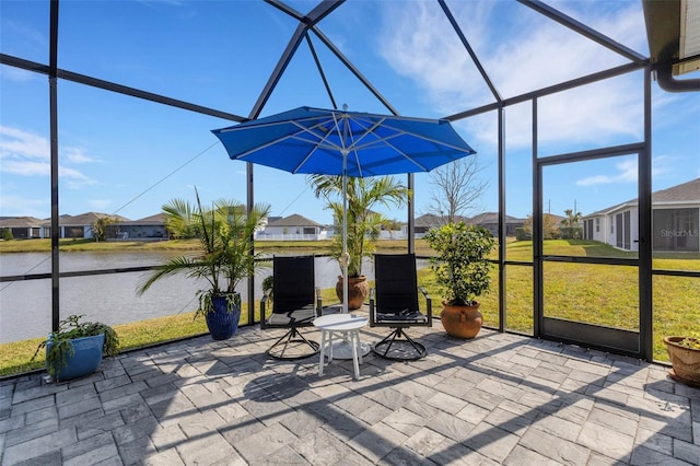 unfurnished sunroom featuring a water view and plenty of natural light