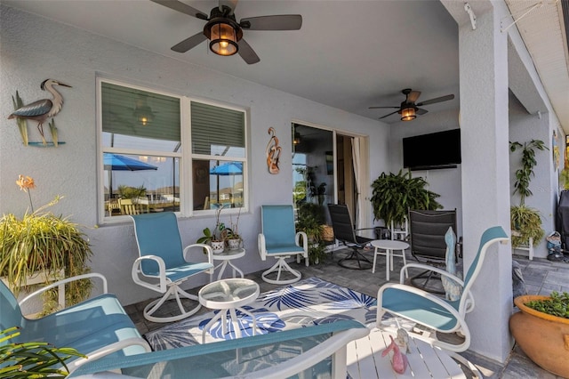 view of patio featuring ceiling fan