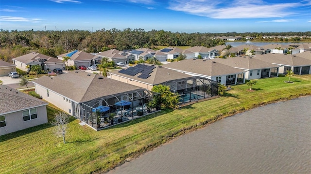 drone / aerial view with a water view