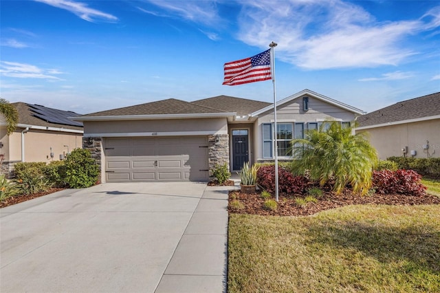 view of front facade featuring a front yard and a garage