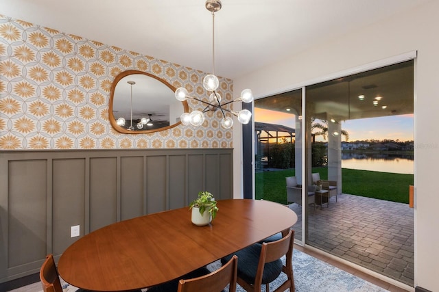 dining space featuring a water view