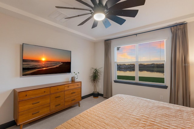 carpeted bedroom with ceiling fan