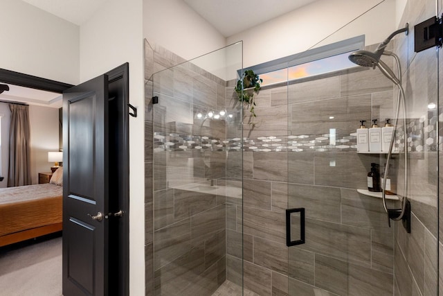 bathroom featuring a shower with shower door