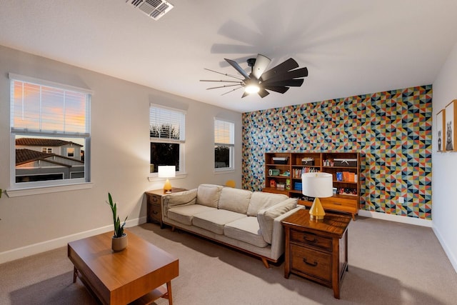 living room featuring carpet floors and ceiling fan