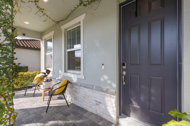 property entrance featuring covered porch